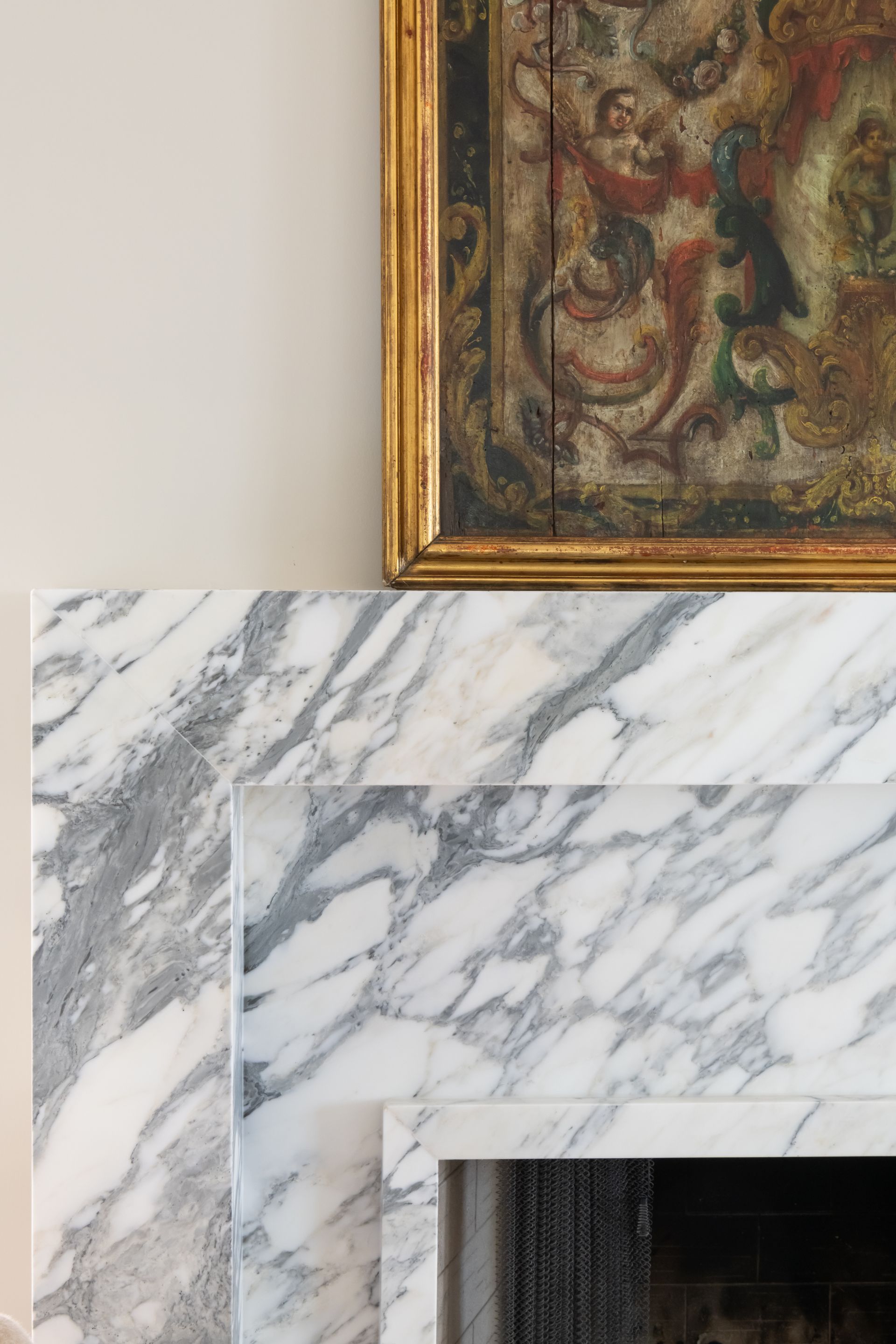 Luxury European inspired kitchen designed by nashville interior designer featuring taj mahal quartzite and white oak cabinets