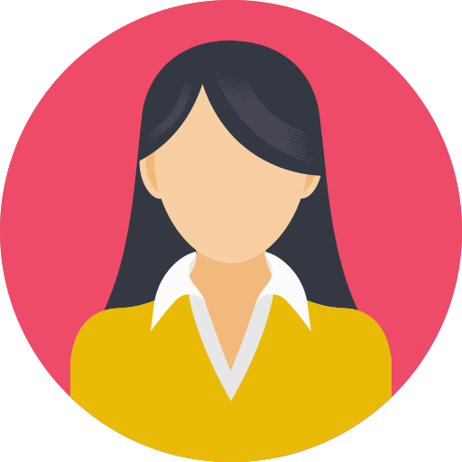 A woman with long black hair is wearing a yellow sweater and a white shirt.