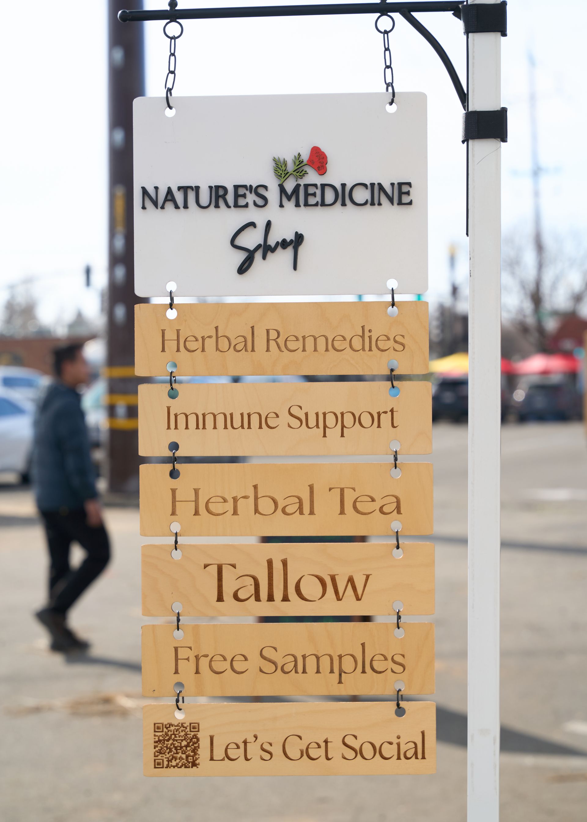 ature's Medicine Shop vendor sign advertising herbal remedies, immune support products, herbal tea, and free samples at the Loomis Community Farmers Market