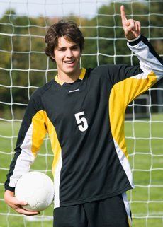 A soccer player with the number 5 on his jersey