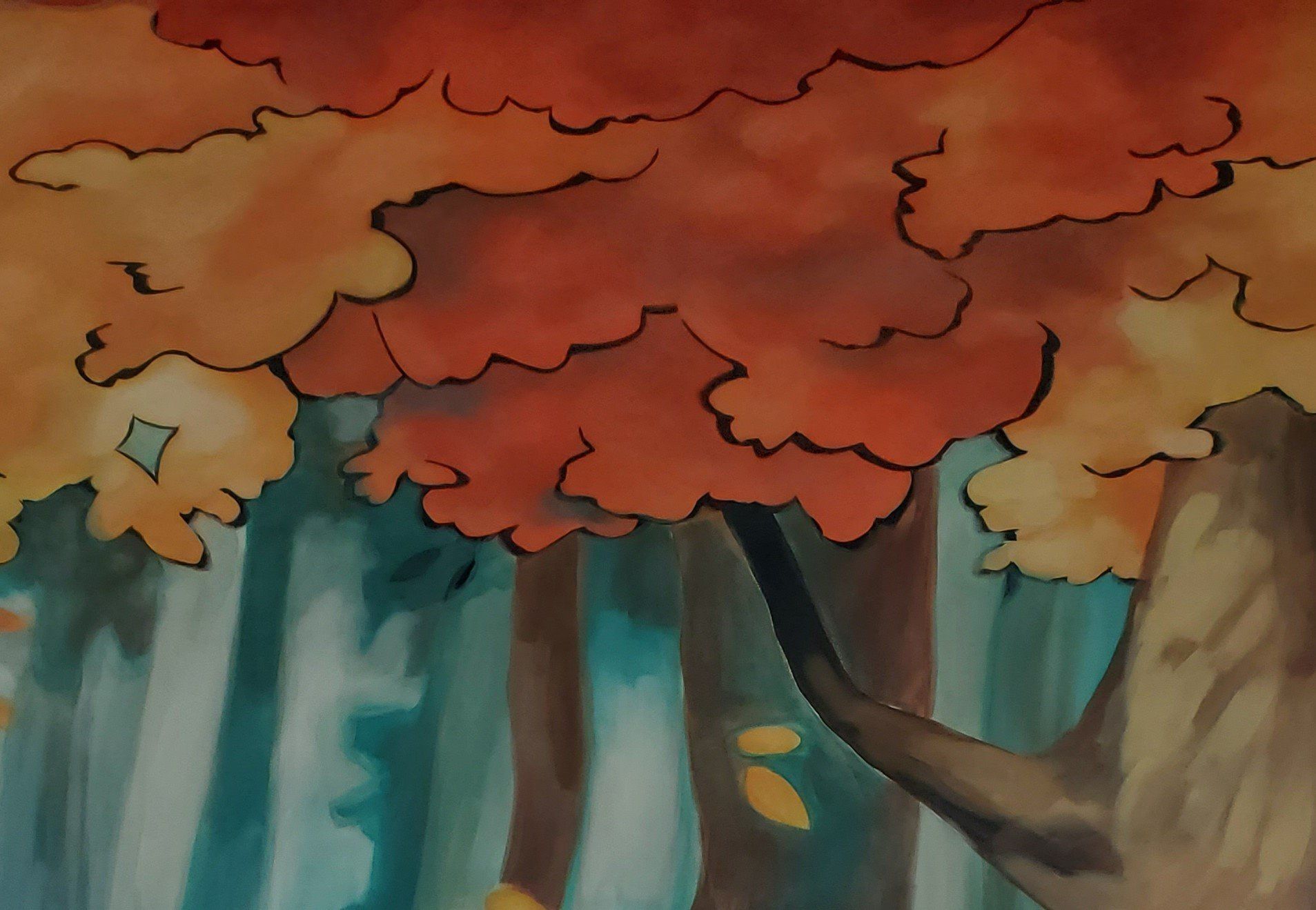 Autumn forest with colorful foliage, brown tree trunks, and soft, blurred background.