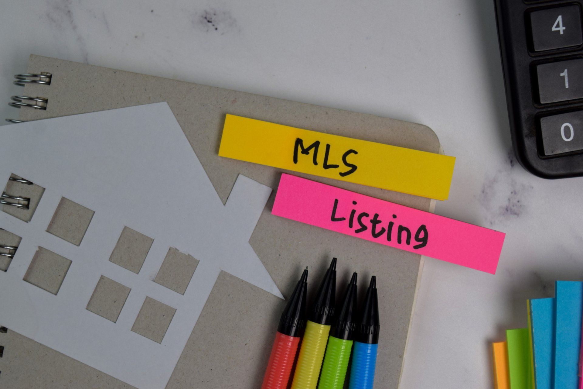Write on a book isolated on office desk - Cypress, CA - Gibson Realty