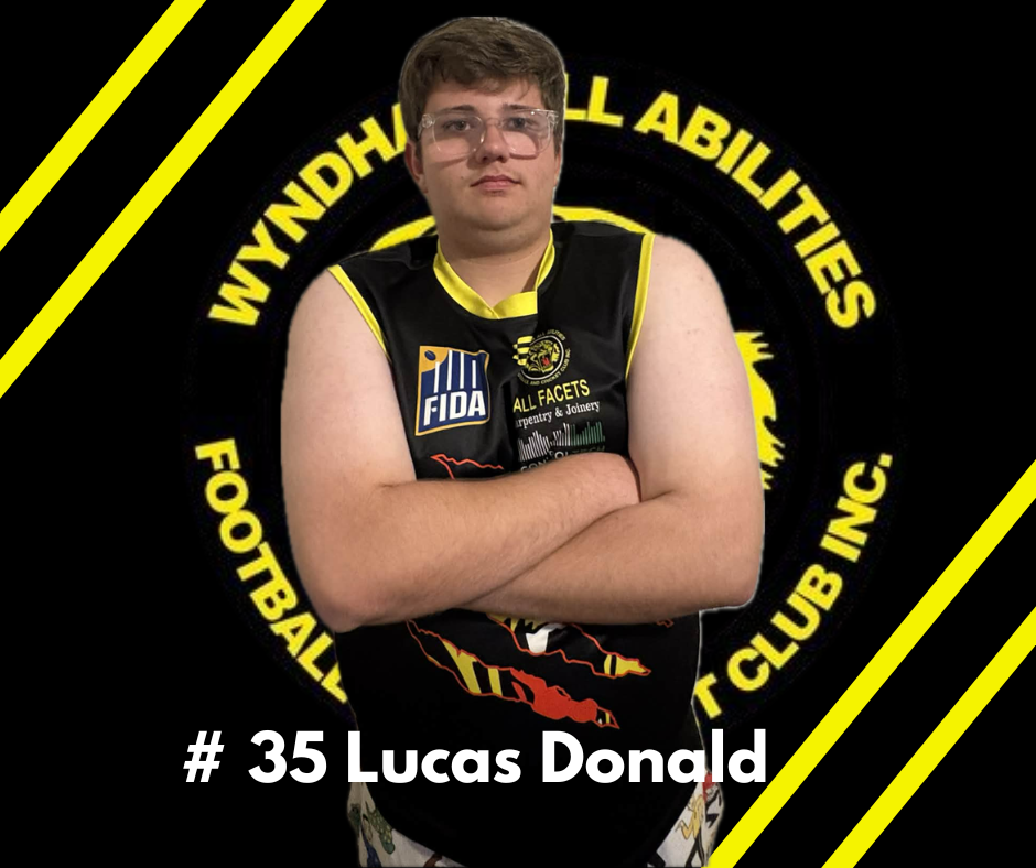 Lucas Donald, jersey number 35, wearing a black and yellow Wyndham All Abilities Football Club uniform with arms crossed.