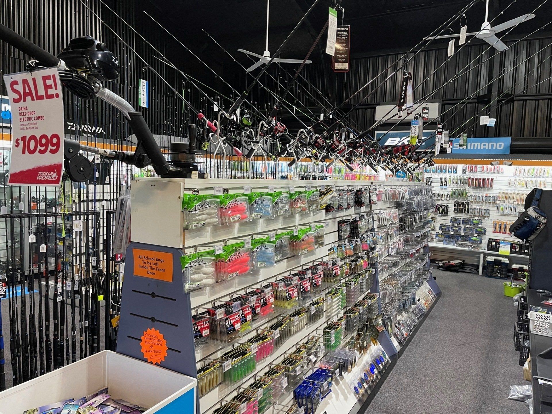lures and jiggers on shelves in tackle store