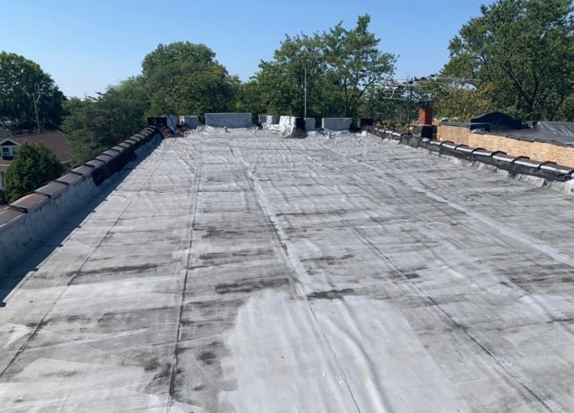 A roof with a lot of trees in the background