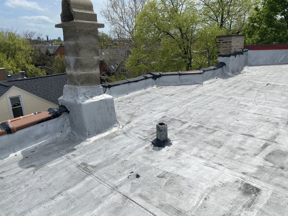 There is a chimney on the roof of a building.