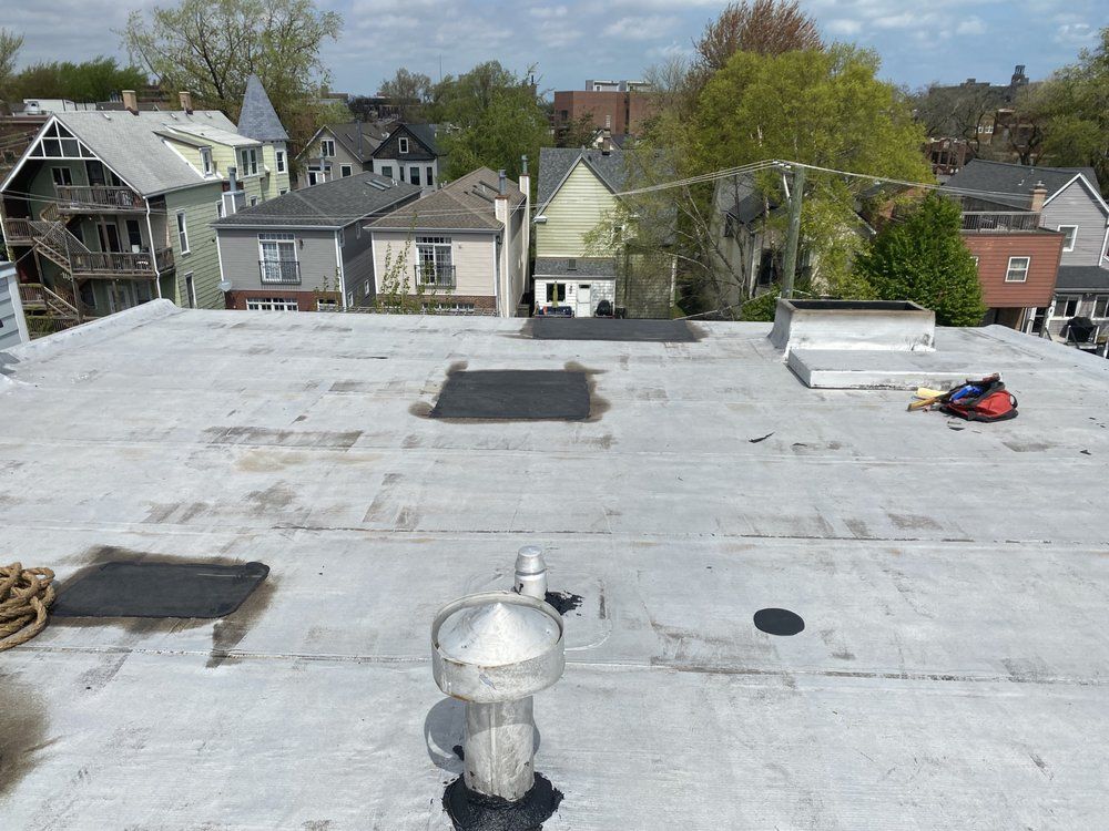The roof of a building with a chimney on it