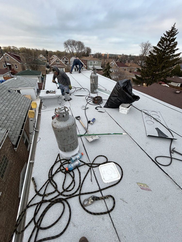 A man is working on the roof of a building.