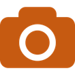 Orange camera icon with a white lens circle.