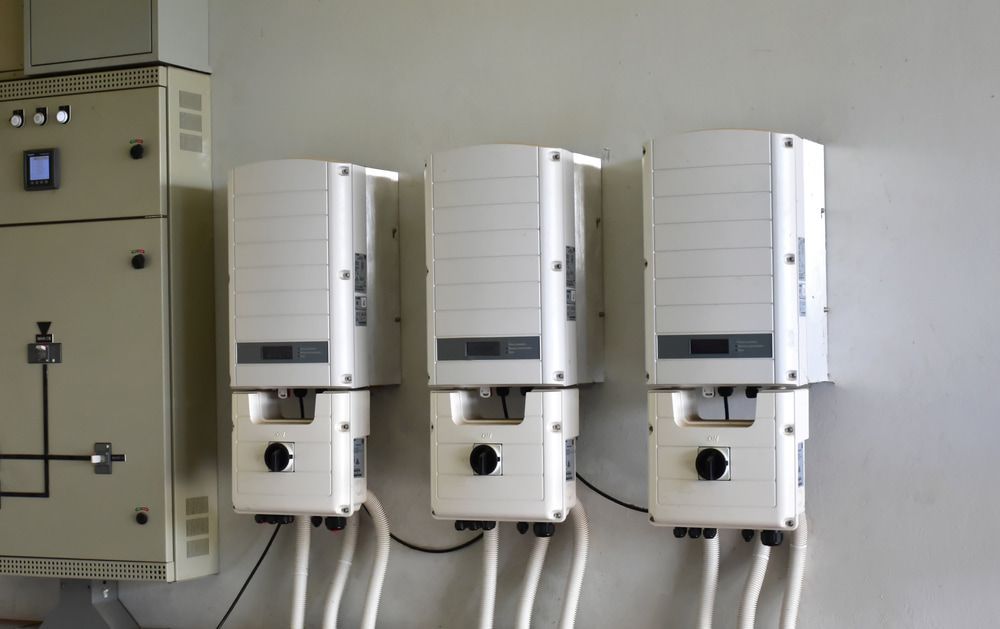 Three White Boxes Are Hanging on a Wall Next to Each Other — 888 Solar Tek in Federal, NSW