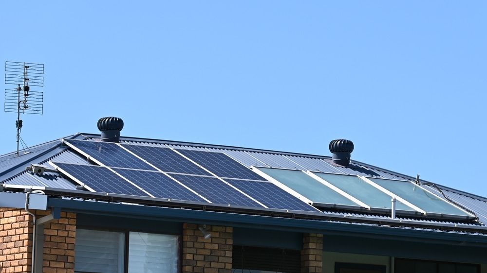 A House With a Lot of Solar Panels on the Roof — 888 Solar Tek in Federal, NSW