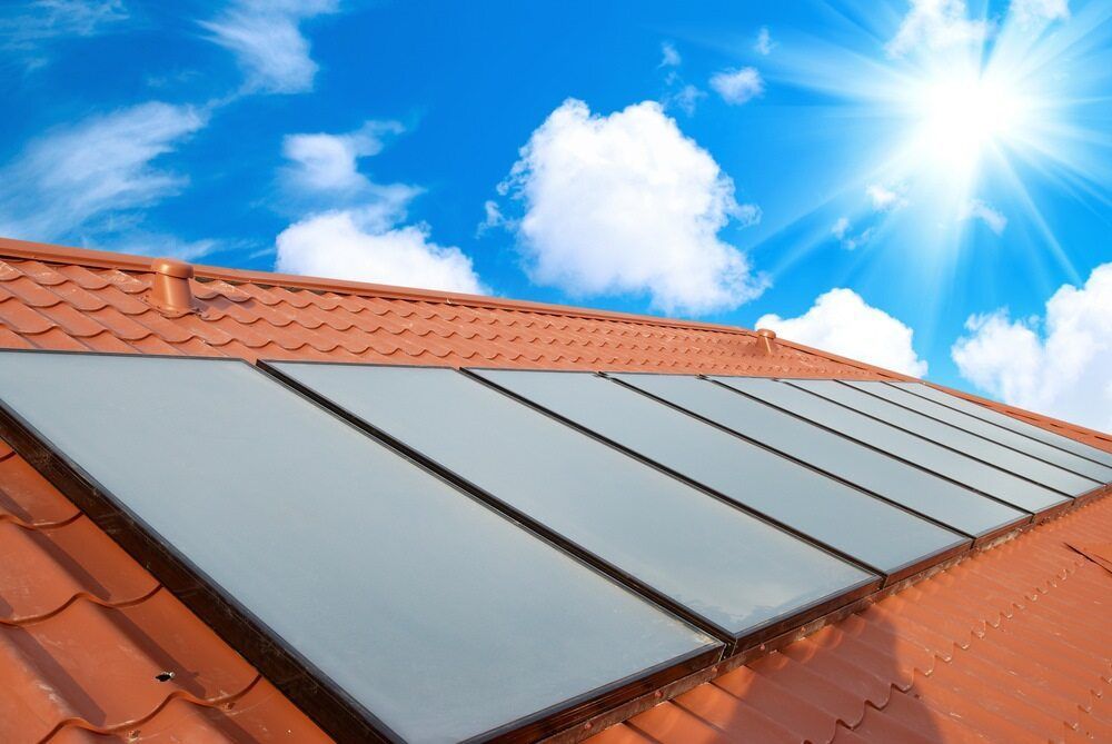 A Row of Solar Panels on a Roof With the Sun Shining Through Them — 888 Solar Tek in Ballina, NSW