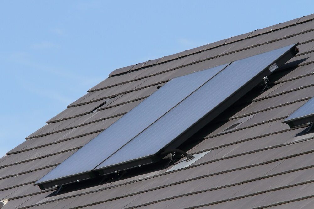 A Roof With Two Solar Panels on It — 888 Solar Tek in Federal, NSW