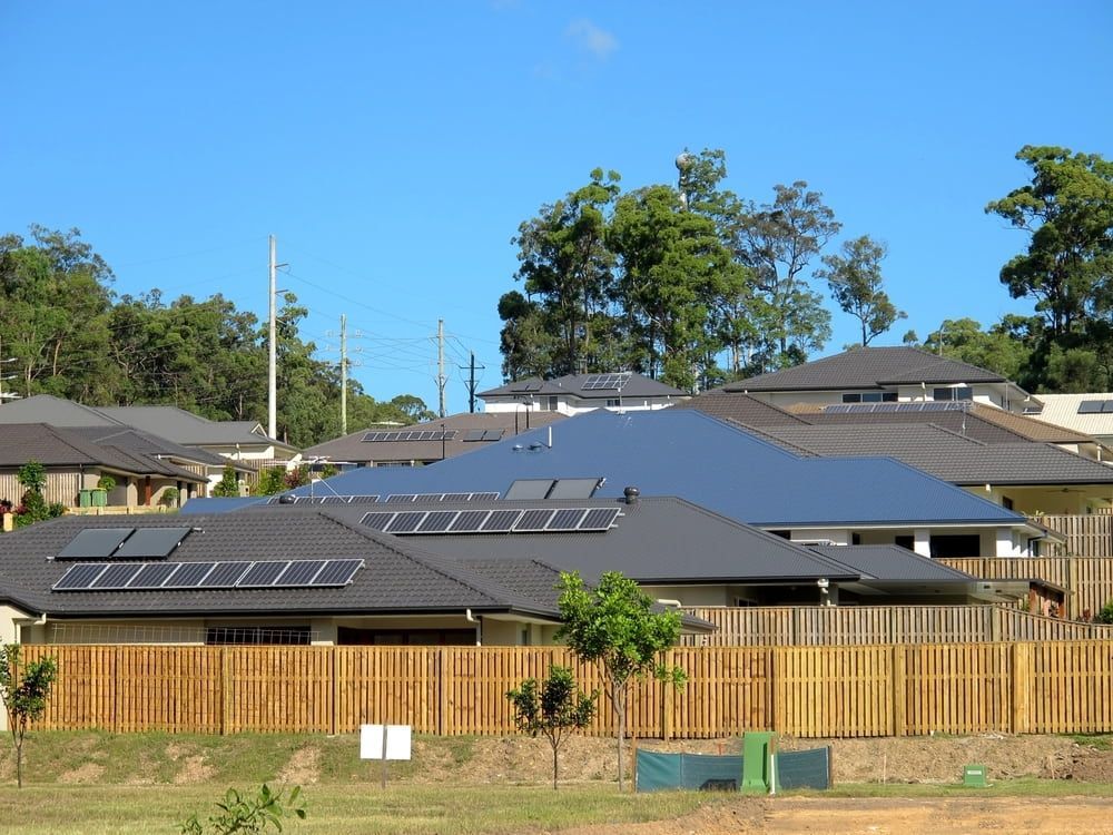A Row of Houses With Solar Panels on the Roofs — 888 Solar Tek in Tweed Heads, NSW