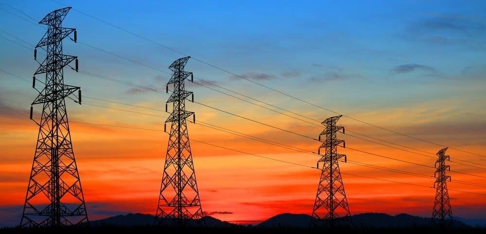 A Row of Power Lines Against a Sunset Sky — 888 Solar Tek in Federal, NSW