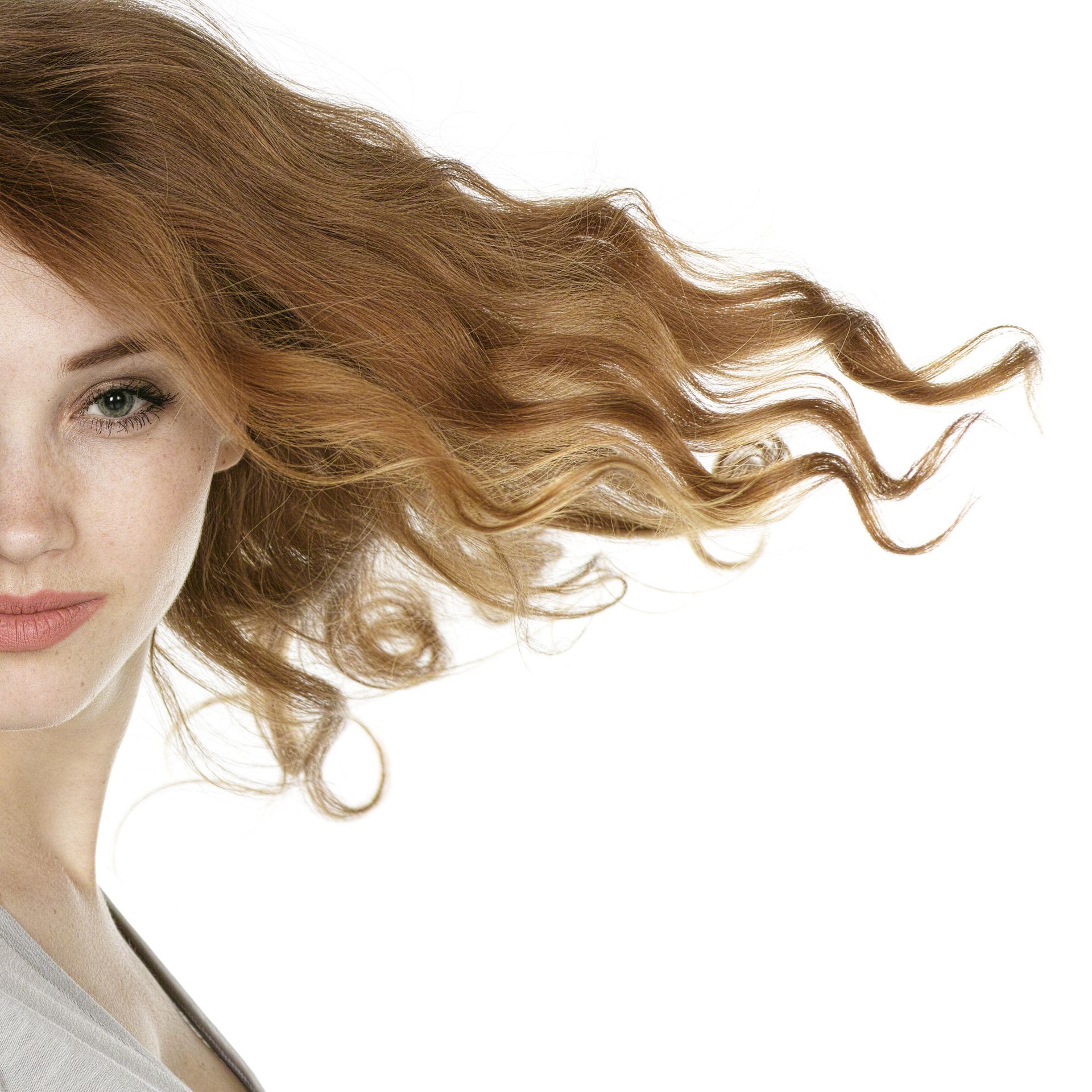 A woman with her hair blowing in the wind