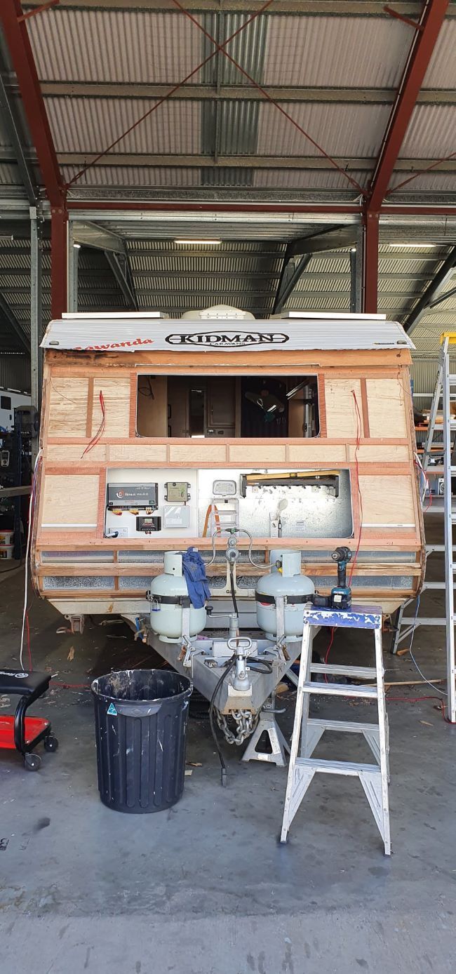 A Camper is Being Remodeled in a Garage — Dempsters Caravan & RV in Thabeban, QLD