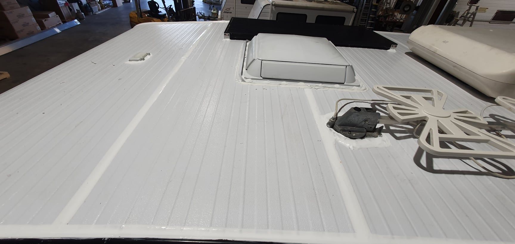 A White Board With a Fan on It is Sitting on Top of a Table — Dempsters Caravan & RV in Thabeban, QLD