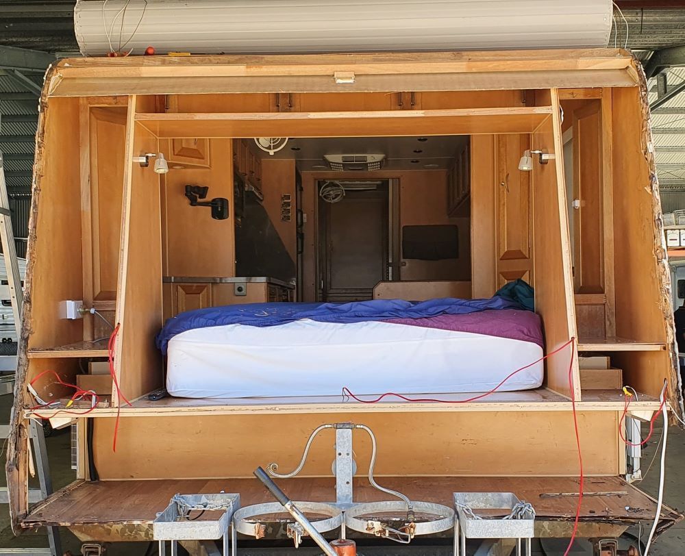 The Inside of a Trailer With a Bed in It — Dempsters Caravan & RV in Thabeban, QLD