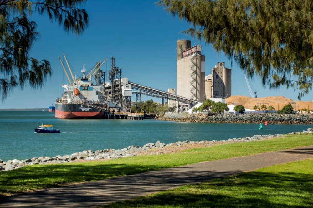 A Large Ship is Docked at a Port Next to a Body of Water — Dempsters Caravan & RV in Gladstone, QLD