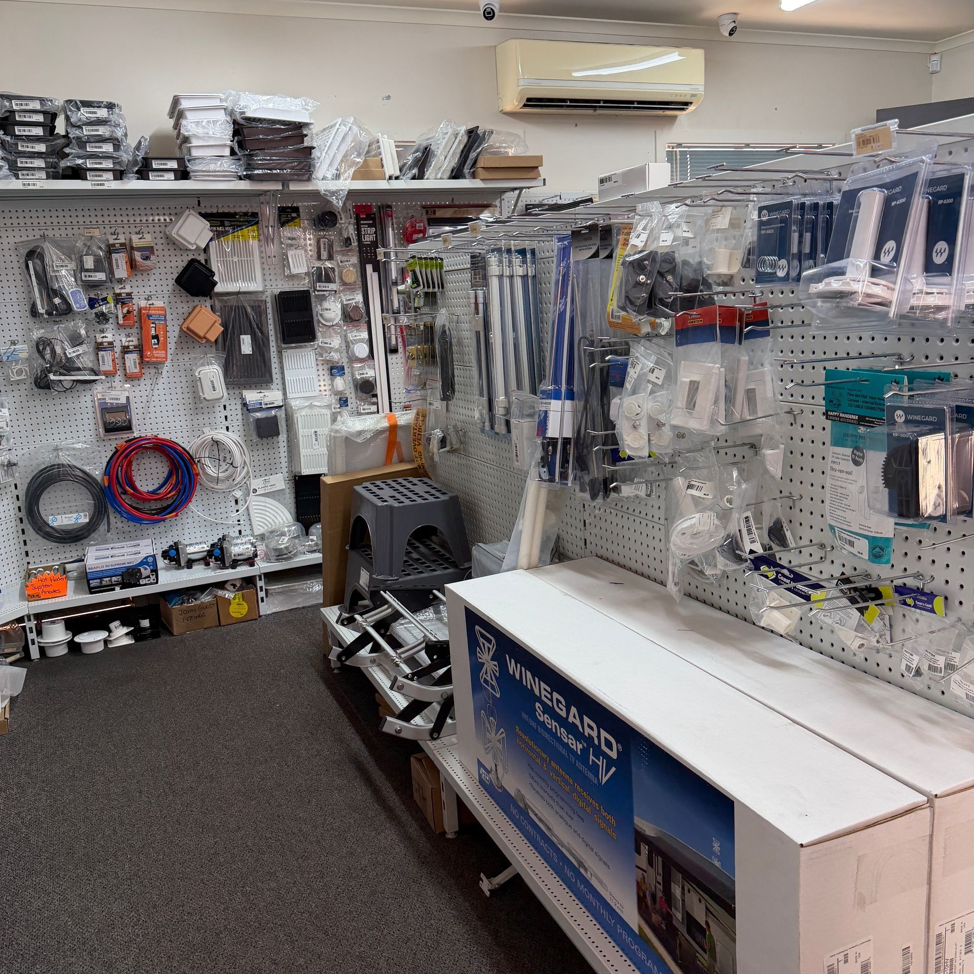 Hardware Store Aisle With Pegboard Displays of Tools, Cords — Dempsters Caravan & RV in Thabeban, QLD