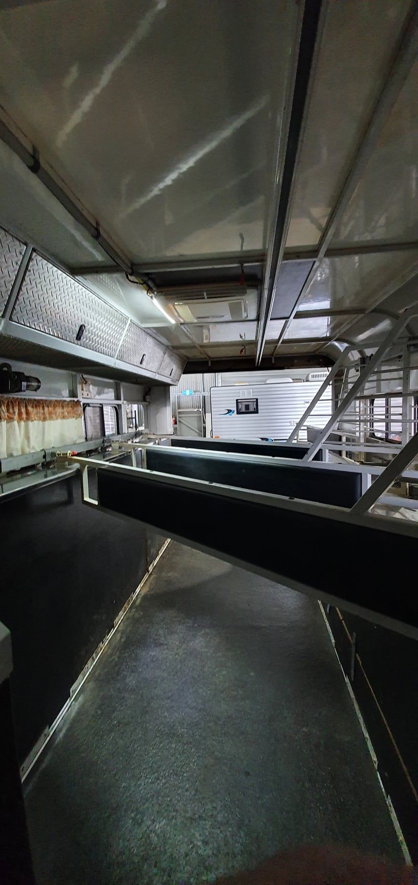 A Large Room With a Lot of Shelves and a Ceiling — Dempsters Caravan & RV in Gladstone, QLD