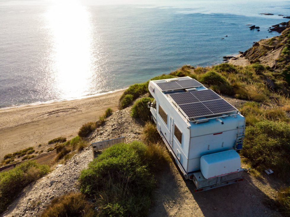A Caravan Overlooks The Beach — Dempsters Caravan & RV in Gladstone, QLD