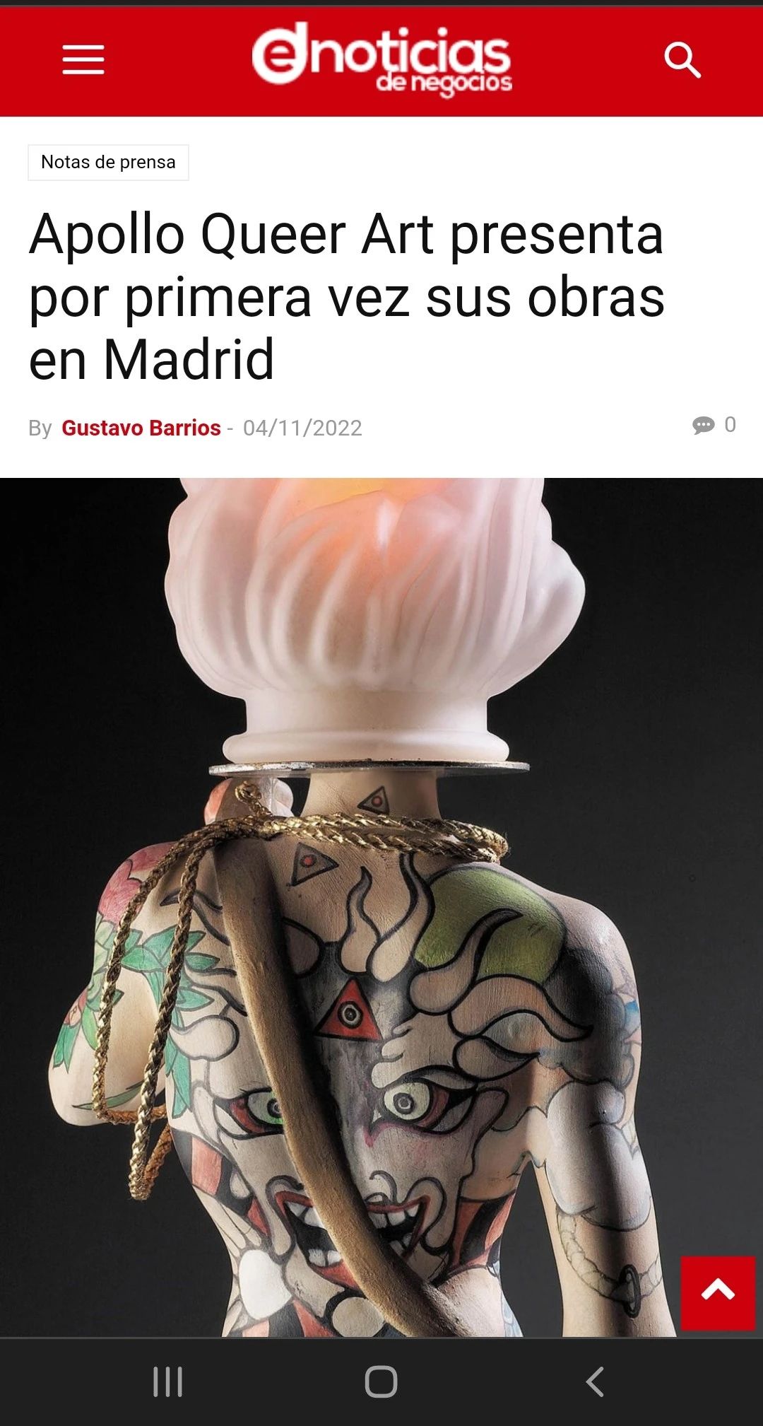 Sculpture of a figure with elaborate tattoos, wearing a necklace and head covering, in Madrid for the first time.