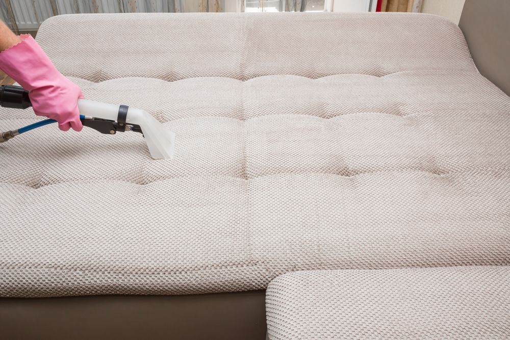 Person in Pink Gloves Using a Cleaning Machine — Kingaroy Carpet Cleaners in Yarraman, QLD