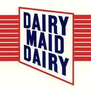 Red Dairy Maid Dairy logo with blue text on a white sign and horizontal red stripes