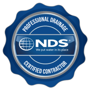 Blue NDS professional drainage certified contractor badge logo with white text and globe icon