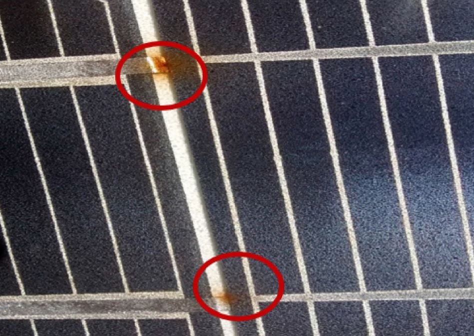 technician using tools for solar panel cleaning
