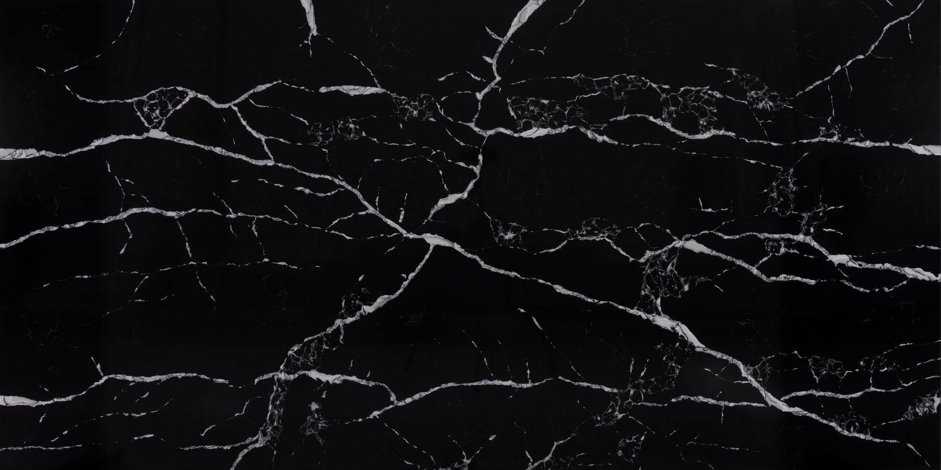 A close up of a black marble texture with white veins