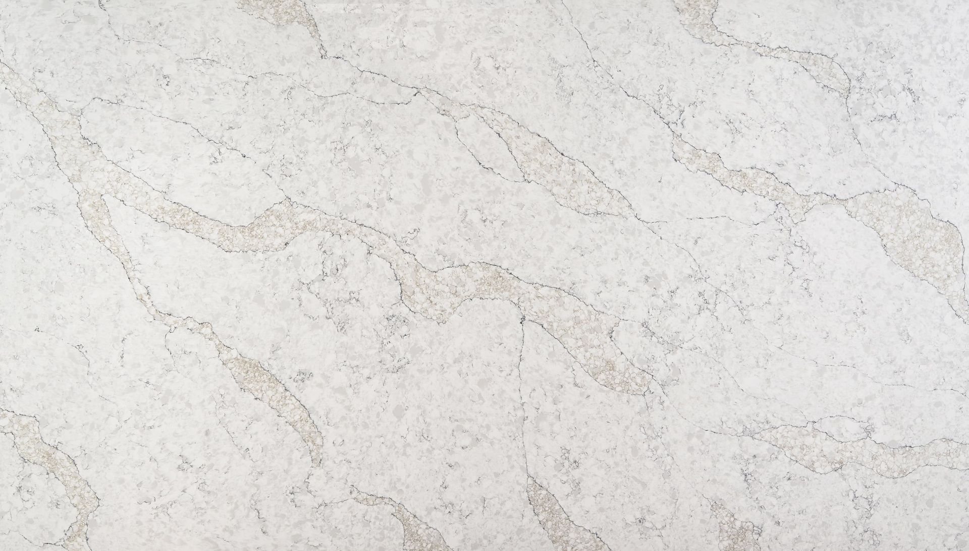 A close up of a white marble counter top.