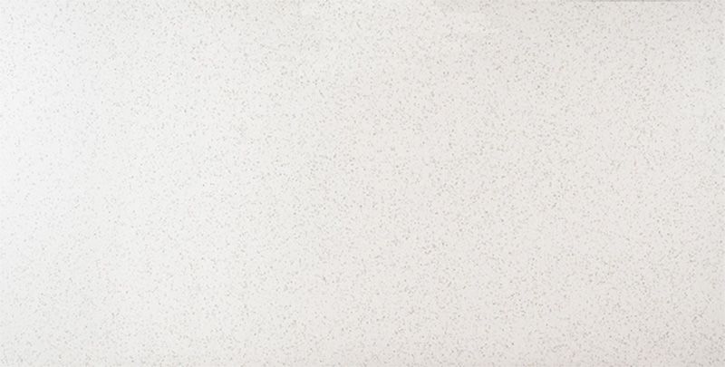 A close up of a piece of white paper with a grainy texture.