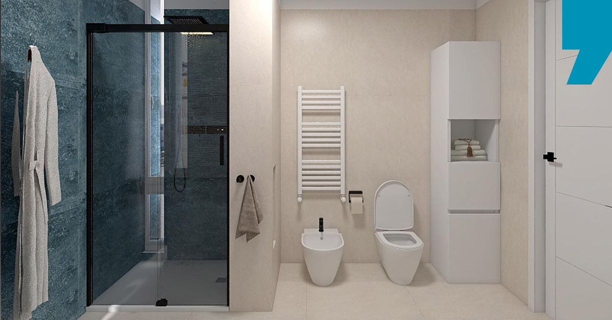 Bagno moderno con doccia in vetro, WC, bidet, mobiletto sottolavabo e termoarredo su pareti beige.