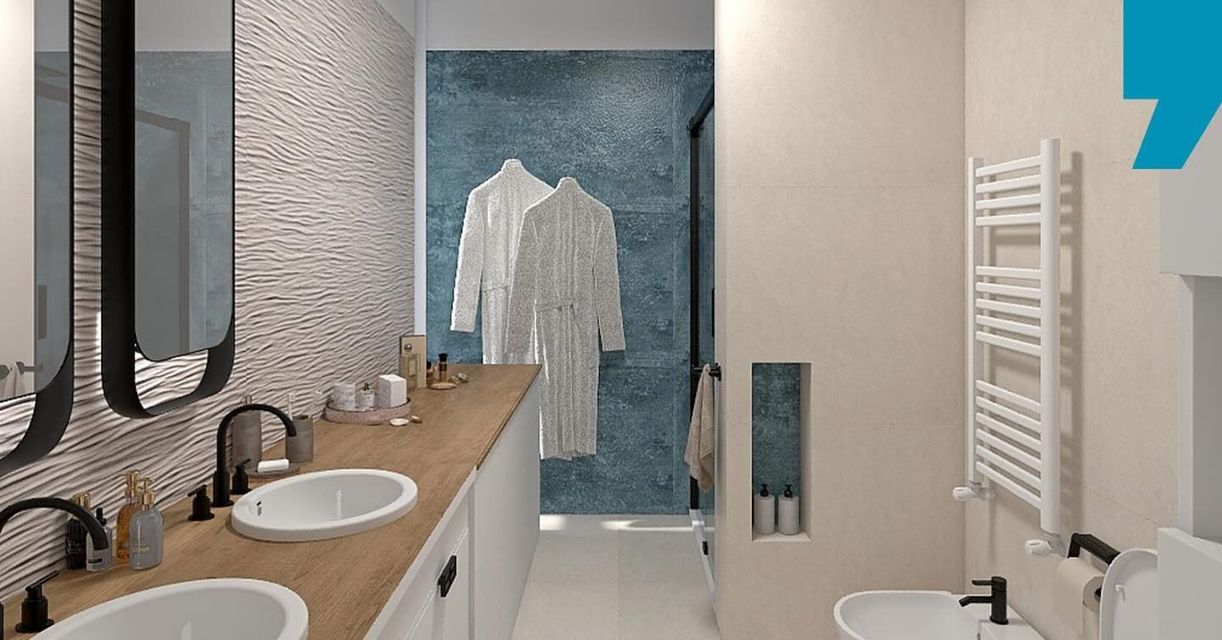 Bagno moderno con doppio lavabo, piano di lavoro in legno, pareti grigie con finitura materica e zona doccia rivestita con piastrelle blu.