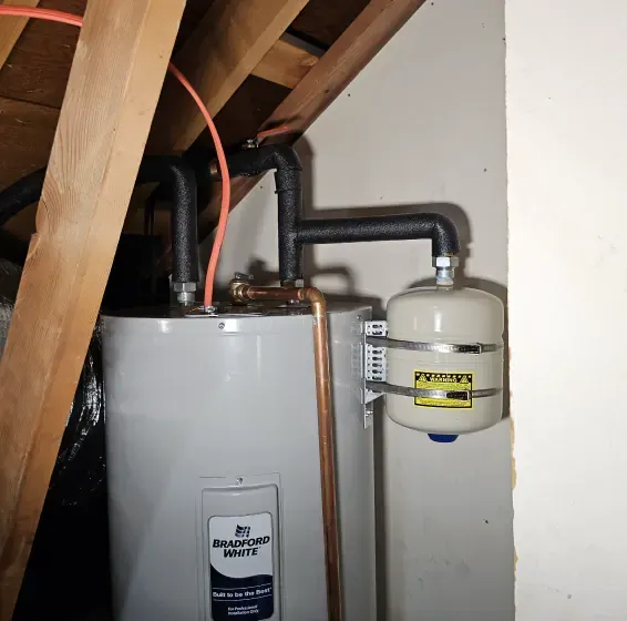 A water heater with a warning label on it