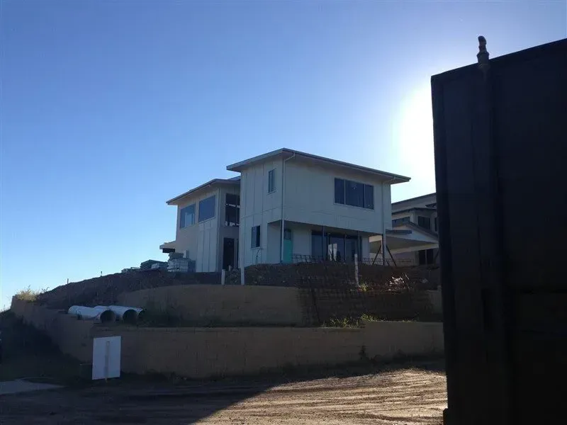 Modern Two-story House on a Hillside — Vision Roofing Fascia & Gutter in Hervey Bay, QLD