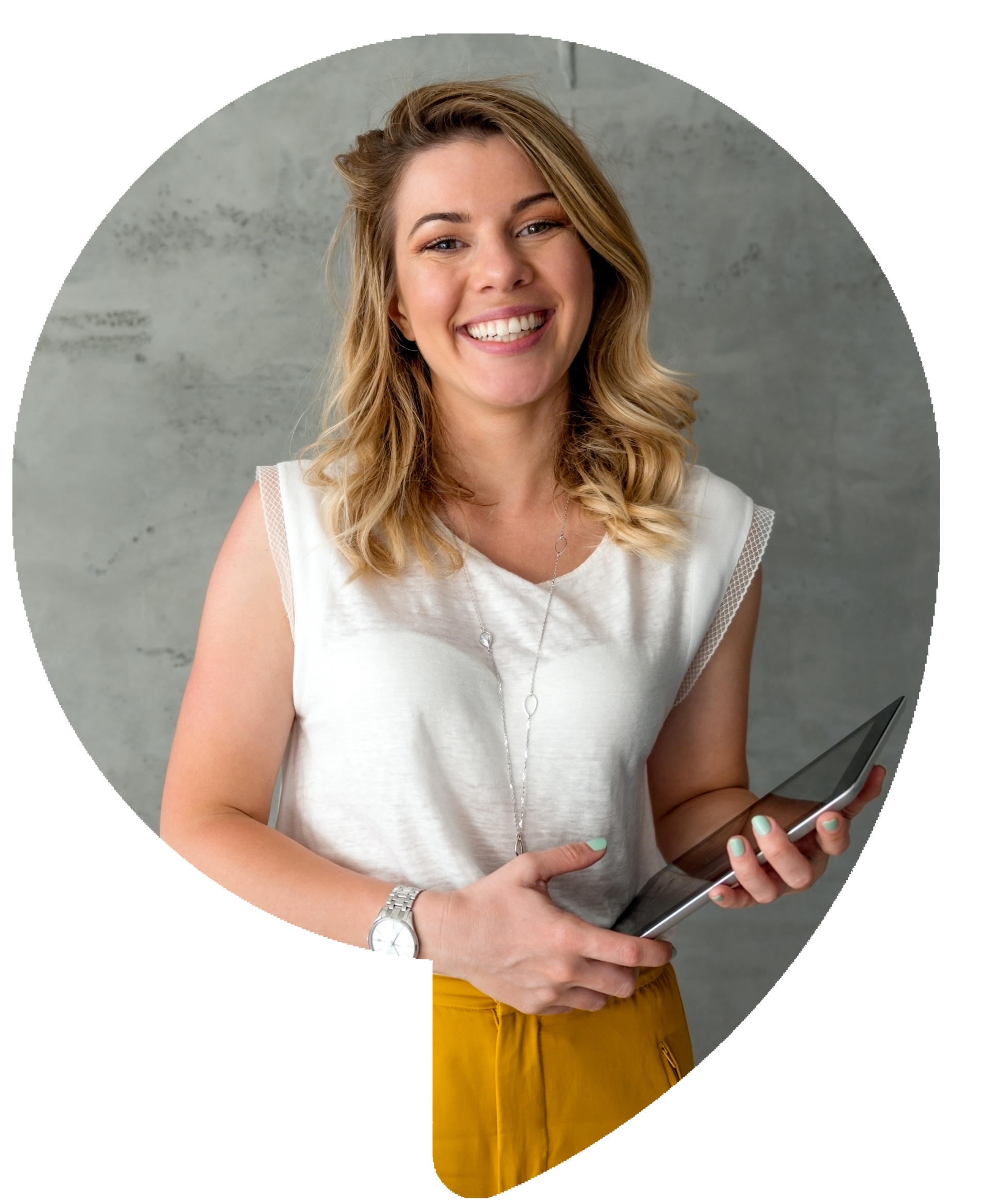 Woman in white top and yellow pants, smiling, holding a tablet.