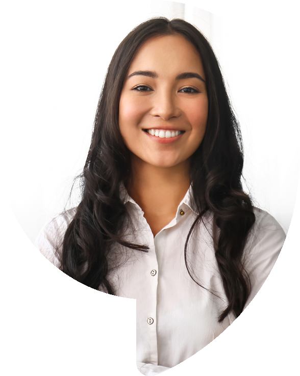 Smiling woman with long, dark hair wearing a white button-down shirt.