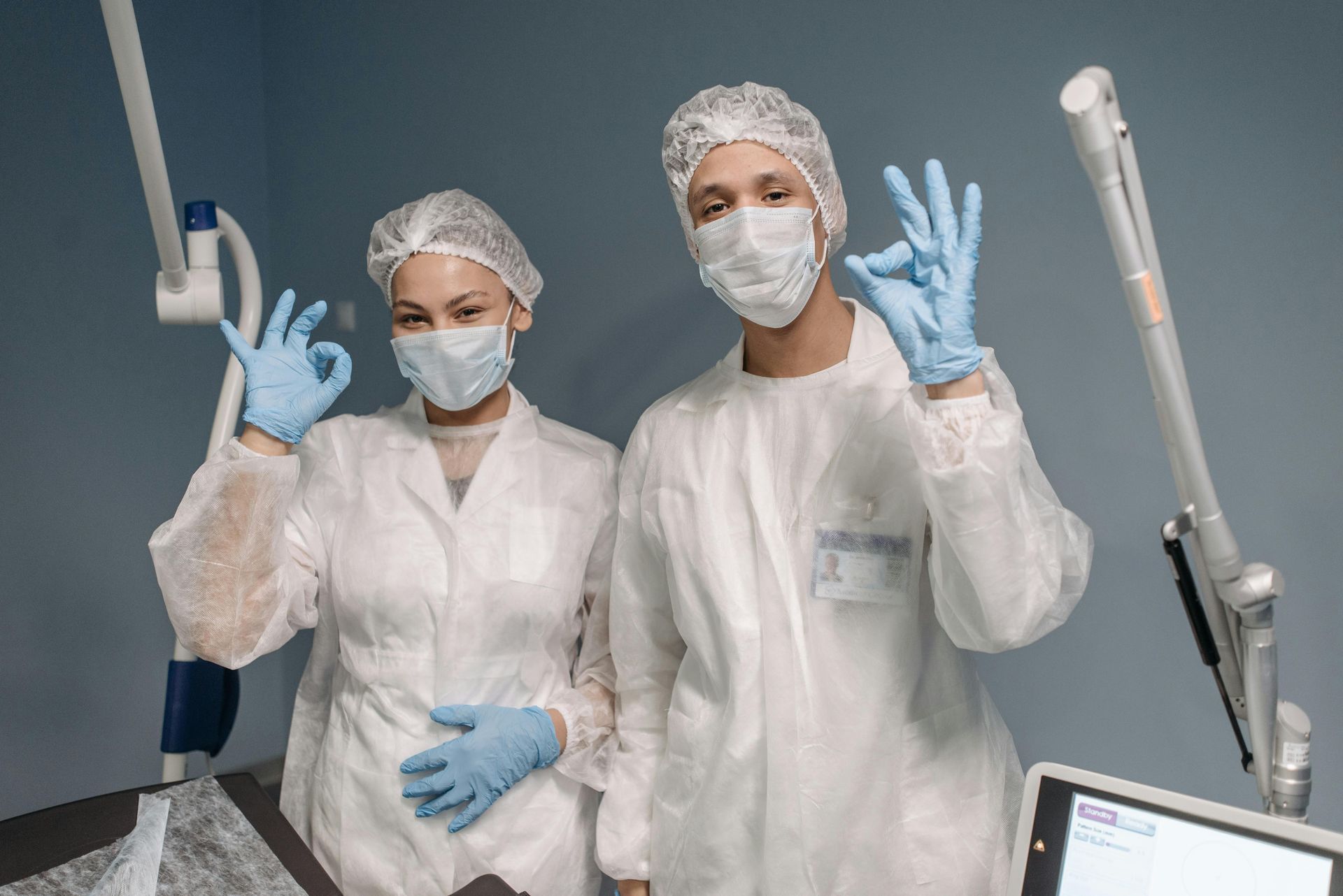 Two people in medical attire giving the 