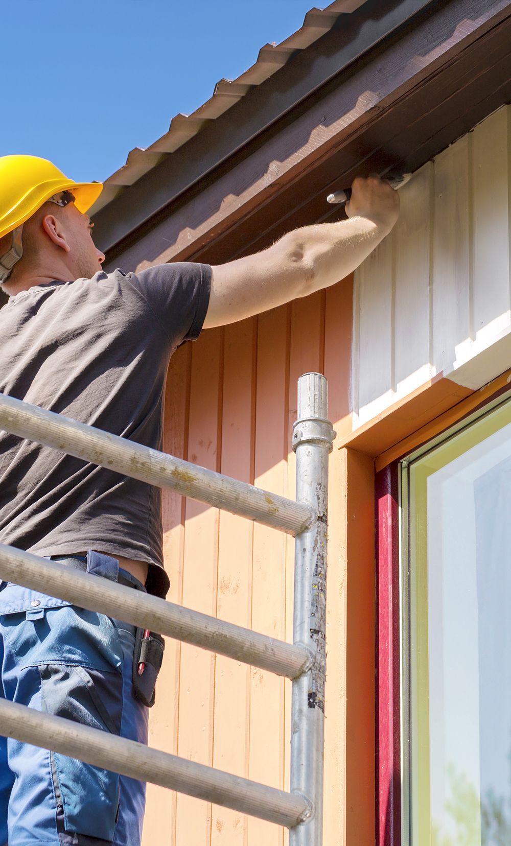Professional Painter Doing Exterior Residential Painting