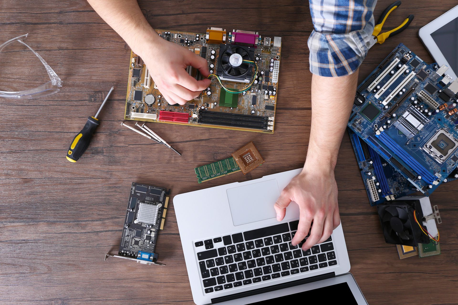 A man is working on a laptop.