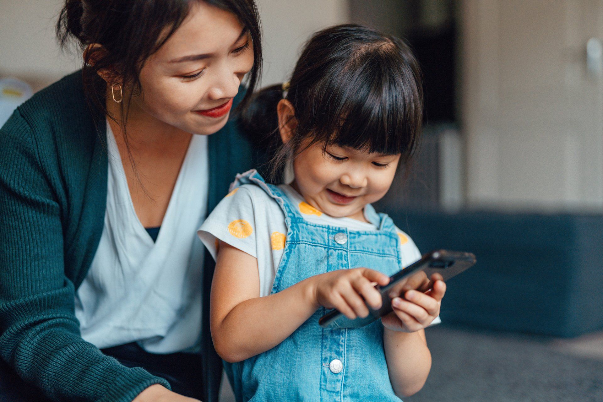 A girl and a kid playing on their phone | Sydney, NSW | Always Apples