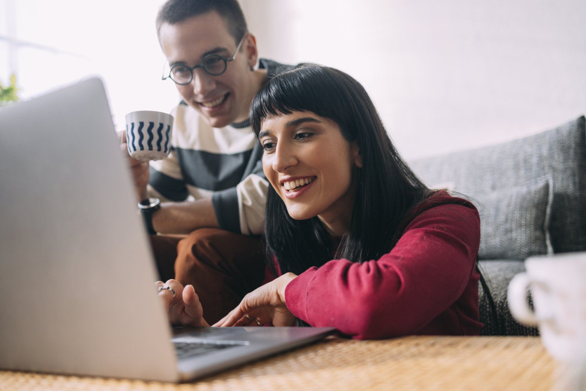 A two-person looking at a laptop and smiling | Sydney, NSW | Always Apples