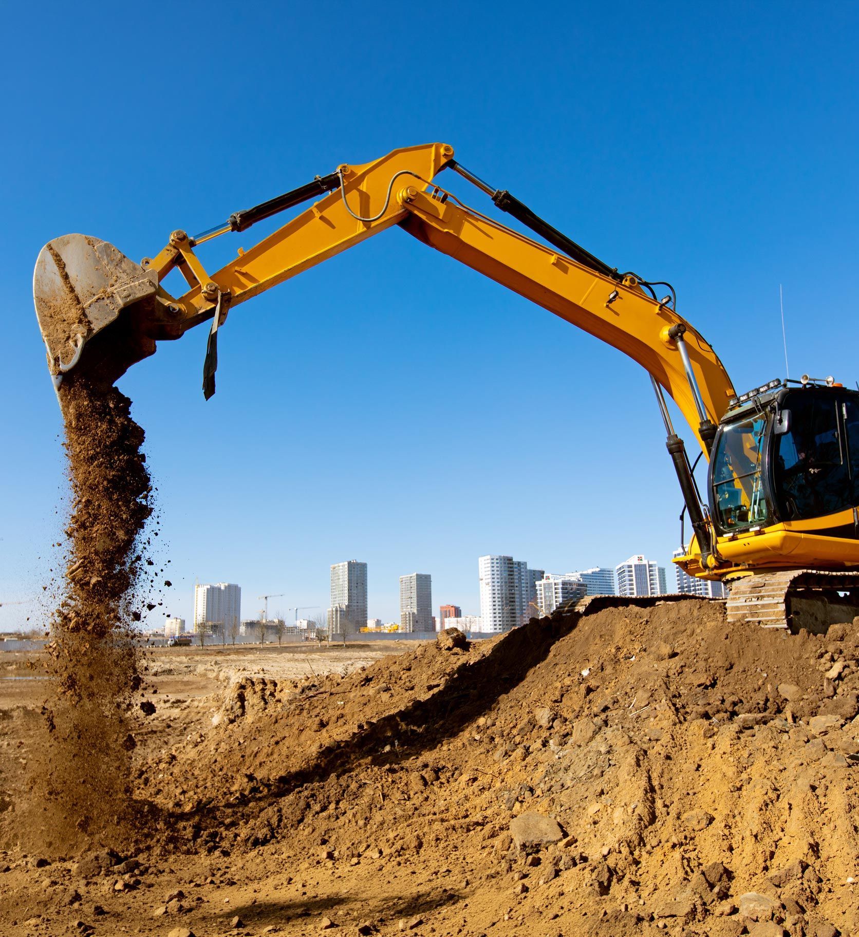 Excavator machine unloading sand or soil at construction site background. Excavator machine unloading sand or soil at construction site background.