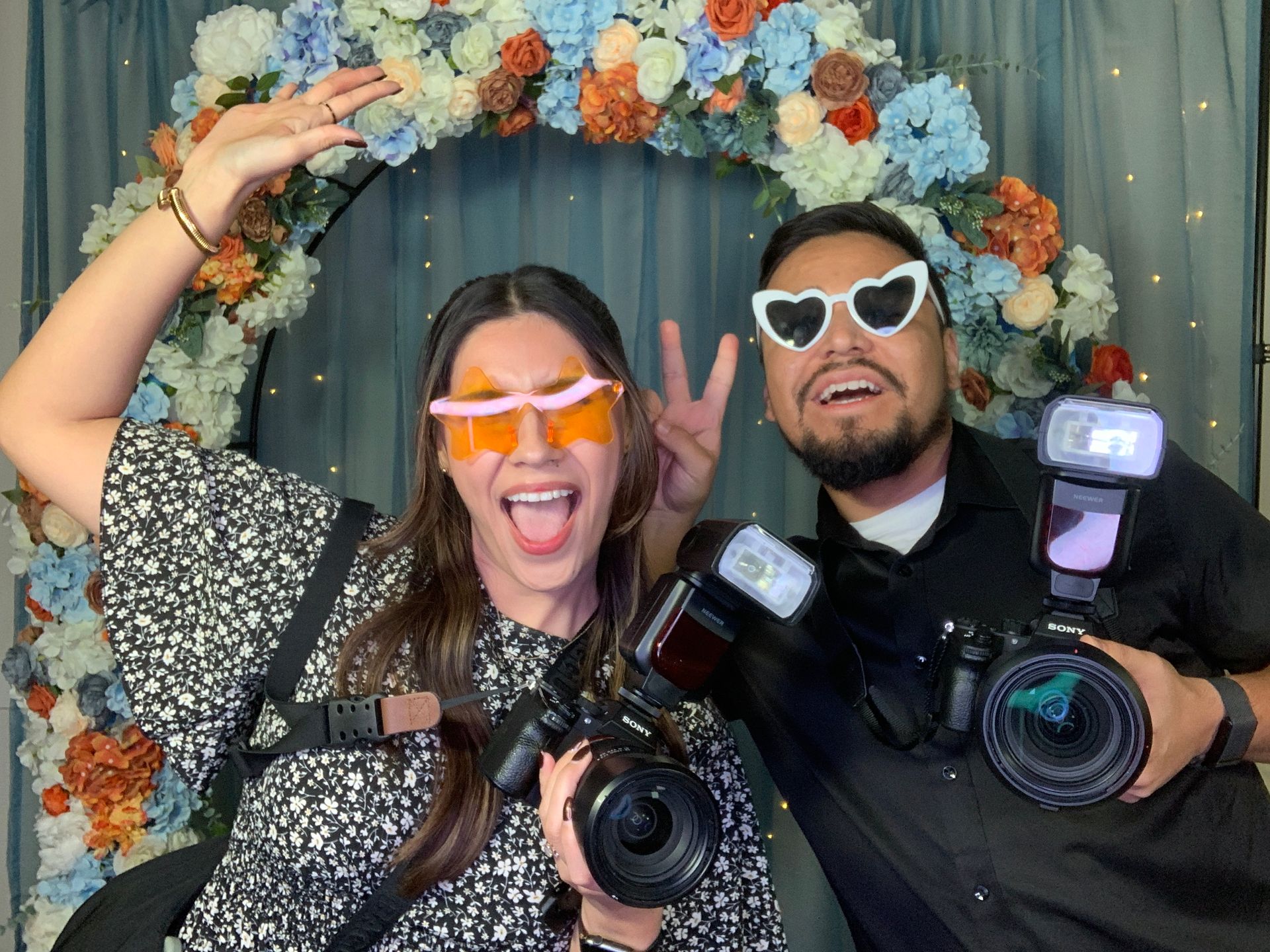 A man and a woman are hugging each other in a field.