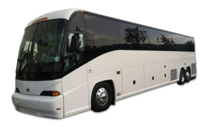 White passenger coach bus with tinted windows, angled on a plain white background