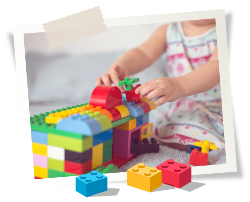 A child is building with colorful toy blocks.
